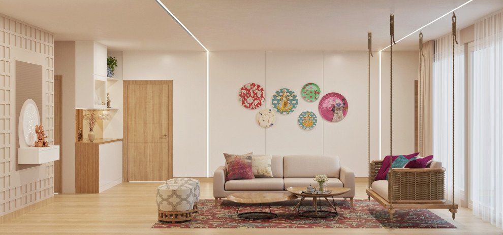 Mittelgroßes, Offenes Klassisches Wohnzimmer mit weißer Wandfarbe, hellem Holzboden, Multimediawand, braunem Boden und Wandpaneelen in Bangalore