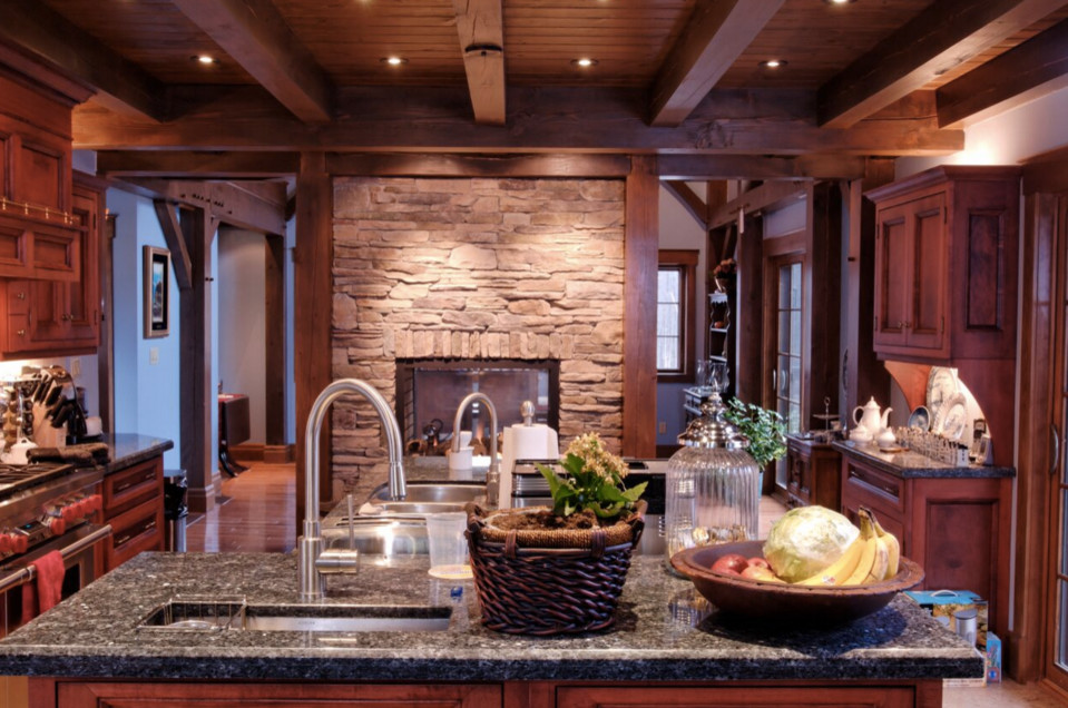 Inspiration for a large rustic galley dark wood floor open concept kitchen remodel in Boston with an undermount sink, shaker cabinets, white cabinets, granite countertops, stainless steel appliances and an island