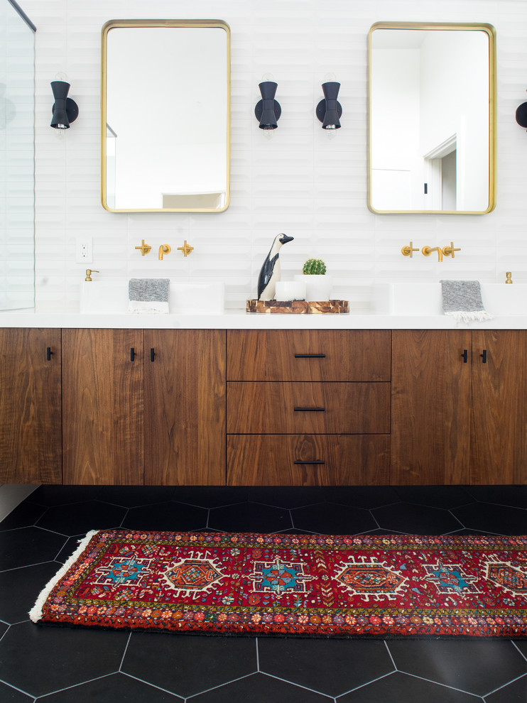 Design ideas for a mid-sized midcentury master bathroom in Orange County with flat-panel cabinets, dark wood cabinets, a freestanding tub, a curbless shower, white tile, ceramic tile, white walls, porcelain floors, a vessel sink, engineered quartz benchtops, black floor and a hinged shower door.