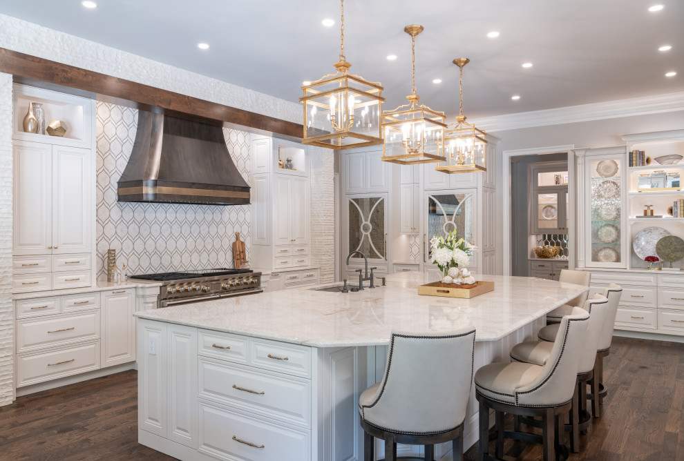 Large traditional eat-in kitchen in Other with beaded inset cabinets, white cabinets, marble benchtops, white splashback, stainless steel appliances, dark hardwood floors, with island, brown floor and white benchtop.