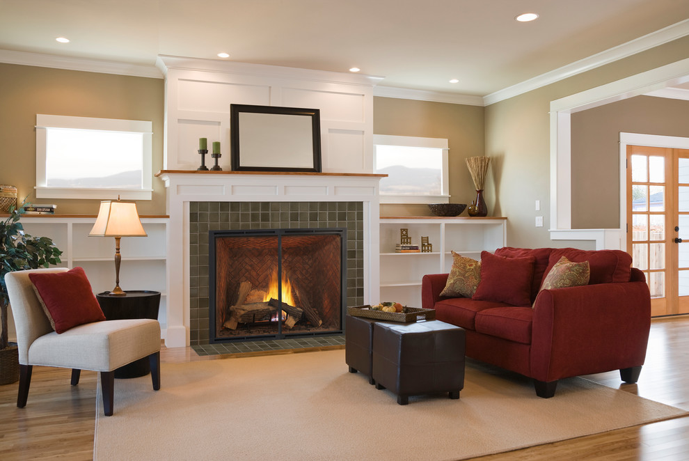 Photo of a mid-sized contemporary formal open concept living room in Boston with a standard fireplace, a tile fireplace surround, no tv, brown walls, light hardwood floors and beige floor.