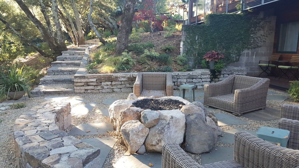 Design ideas for a large country backyard patio in New York with a fire feature, gravel and no cover.