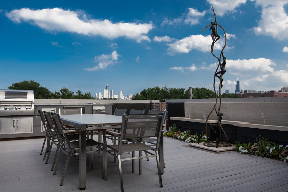 Inspiration for a mid-sized contemporary rooftop deck in Chicago with a water feature and no cover.