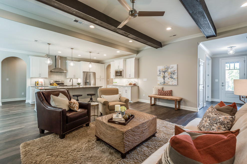 Mid-sized transitional l-shaped open concept kitchen photo with an undermount sink, flat-panel cabinets, white cabinets, quartz countertops, white backsplash, glass tile backsplash, stainless steel appliances, an island and white countertops
