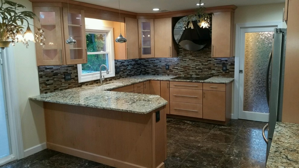 Example of a huge transitional u-shaped marble floor eat-in kitchen design in Newark with an undermount sink, flat-panel cabinets, light wood cabinets, granite countertops, brown backsplash, mosaic tile backsplash and stainless steel appliances