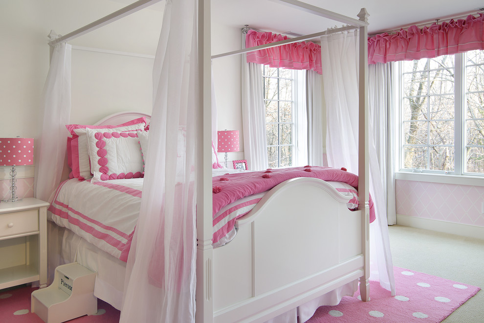 Traditional guest bedroom in New York with pink walls, carpet and beige floor.
