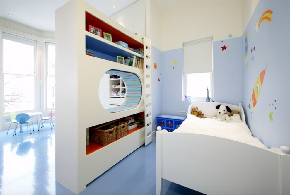 Design ideas for a contemporary kids' bedroom for kids 4-10 years old and boys in London with blue walls, blue floor and linoleum floors.