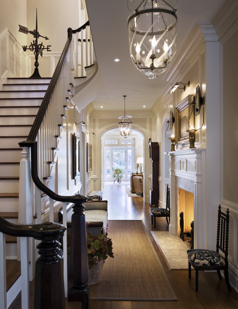 Expansive traditional foyer in New York with light hardwood floors.