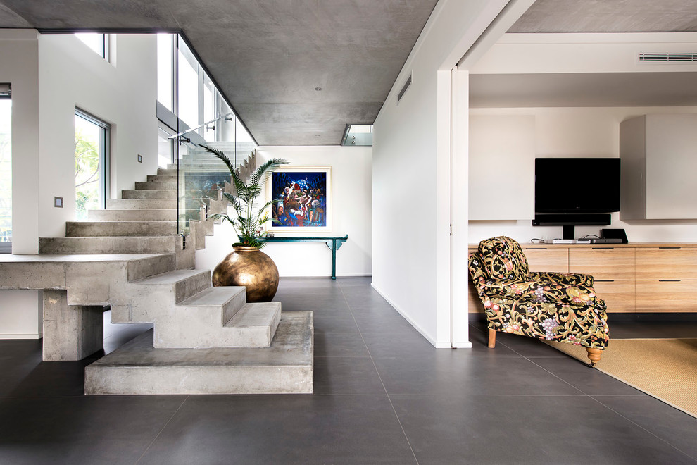 Inspiration for a contemporary foyer in Perth with white walls and grey floor.
