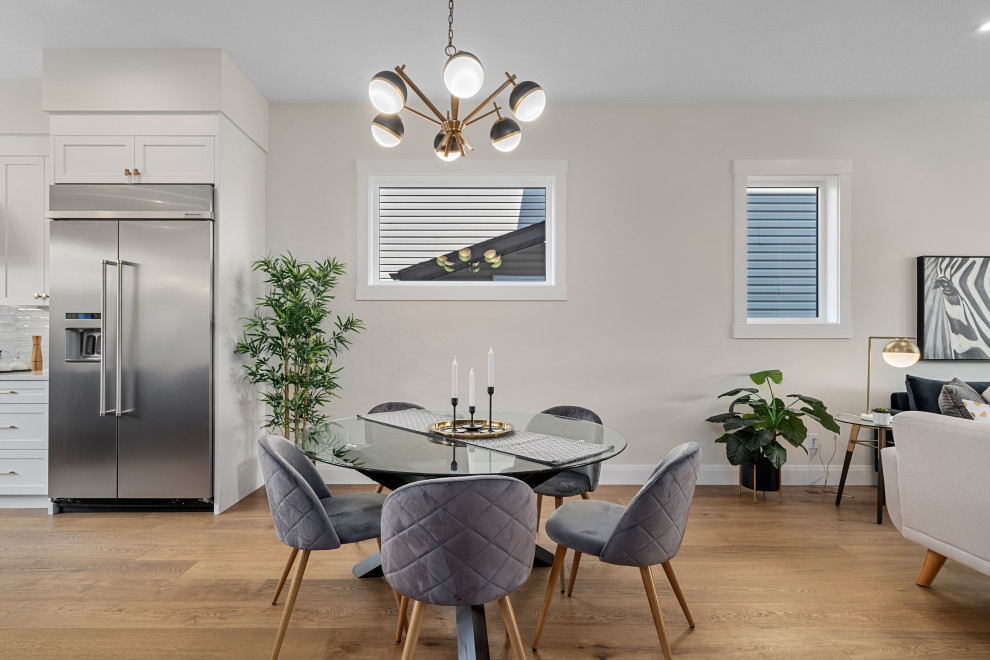 Transitional dining room photo in Calgary