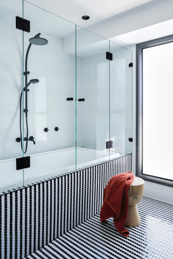 Photo of a large contemporary kids bathroom in Sydney with furniture-like cabinets, black cabinets, a drop-in tub, a shower/bathtub combo, a two-piece toilet, white tile, ceramic tile, white walls, mosaic tile floors, a vessel sink, granite benchtops, black floor, a hinged shower door, black benchtops, a single vanity and a freestanding vanity.