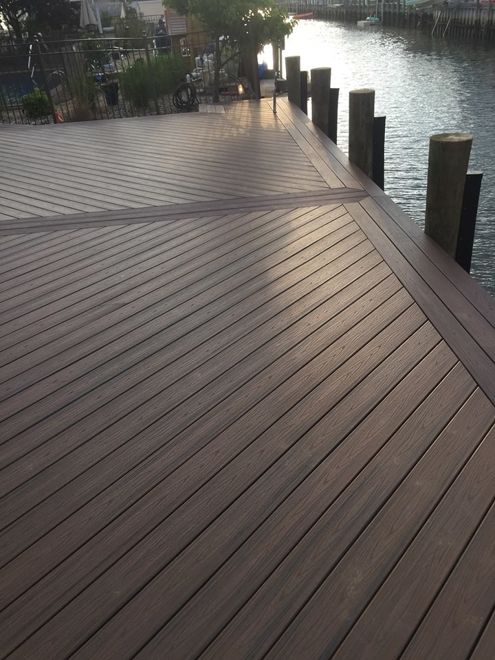 Photo of a large traditional backyard deck in New York.
