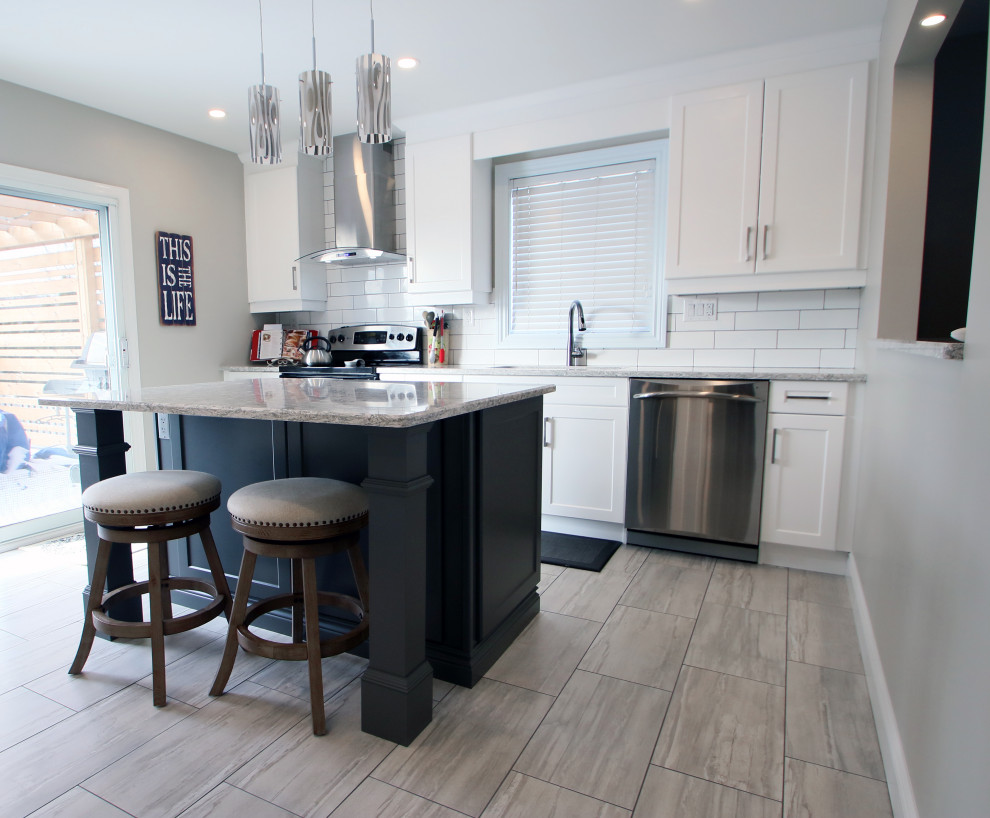 Eat-in kitchen - mid-sized transitional galley porcelain tile and gray floor eat-in kitchen idea with a double-bowl sink, shaker cabinets, white cabinets, granite countertops, white backsplash, subway tile backsplash, stainless steel appliances, no island and gray countertops