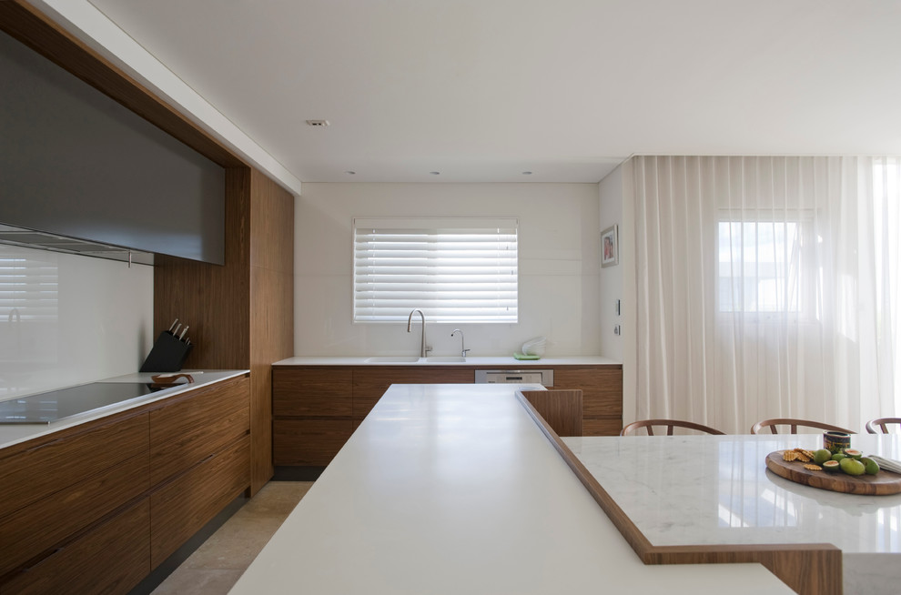 Inspiration for a contemporary open plan kitchen in Sydney with an integrated sink, flat-panel cabinets, dark wood cabinets, solid surface benchtops, white splashback and glass sheet splashback.