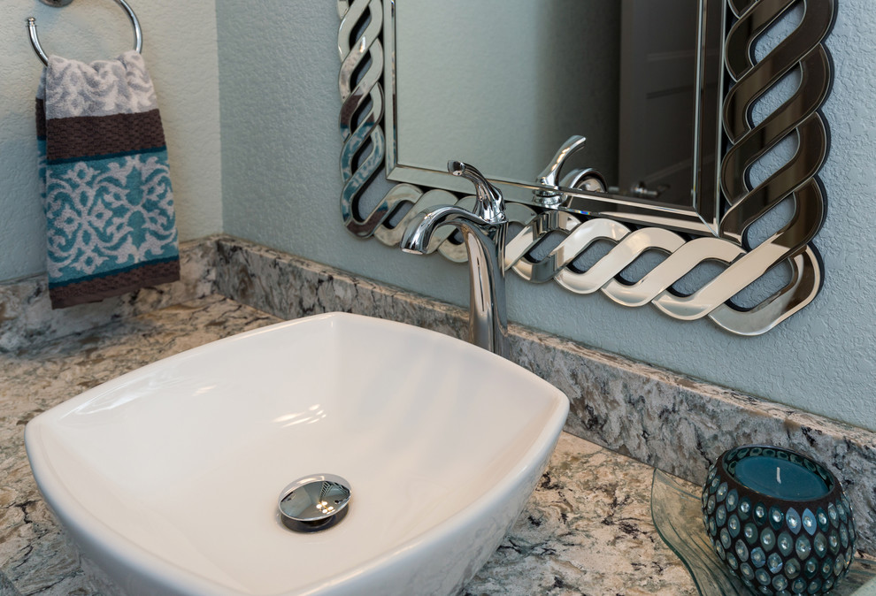Inspiration for a transitional 3/4 beige tile bathroom remodel with a vessel sink, white cabinets, quartz countertops, a two-piece toilet and blue walls