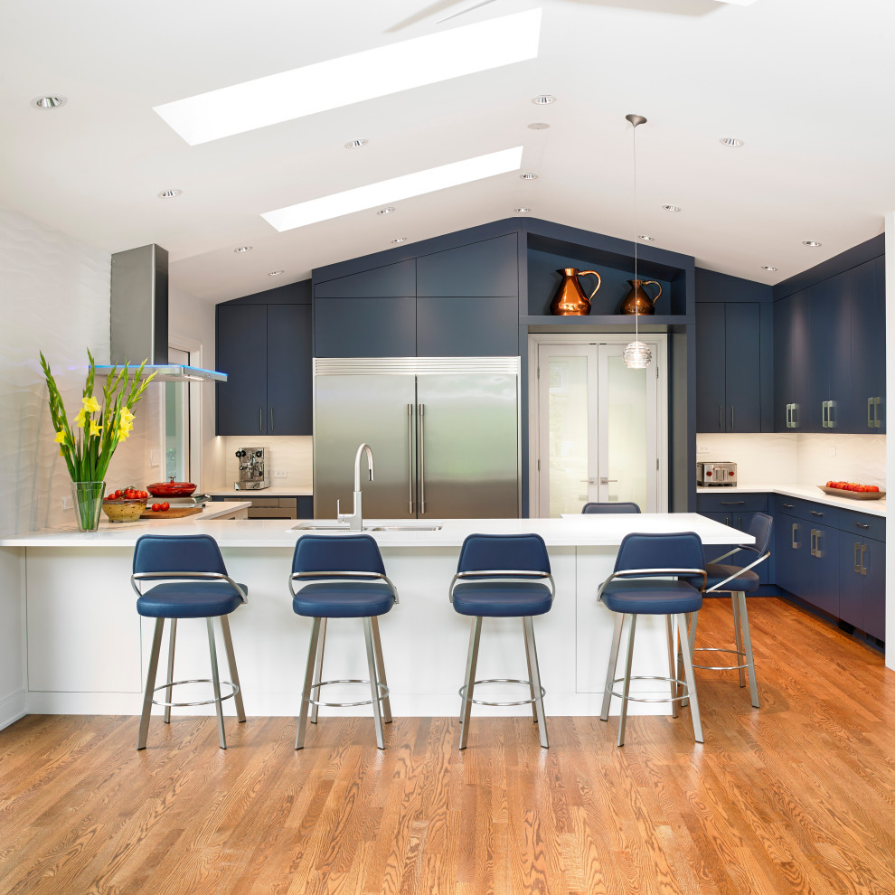 Inspiration for a large contemporary u-shaped open plan kitchen in Other with an undermount sink, flat-panel cabinets, blue cabinets, quartz benchtops, white splashback, ceramic splashback, stainless steel appliances, medium hardwood floors, with island, orange floor, white benchtop and vaulted.
