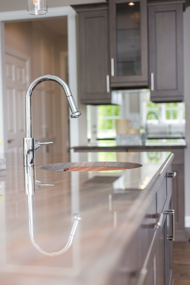Inspiration for a large transitional u-shaped dark wood floor eat-in kitchen remodel in DC Metro with an undermount sink, shaker cabinets, white cabinets, quartz countertops, beige backsplash, mosaic tile backsplash, stainless steel appliances and an island