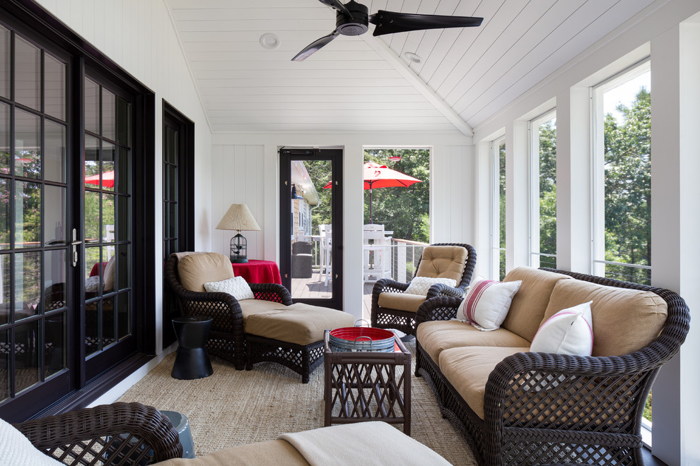 This is an example of a scandinavian screened-in verandah in Boston.