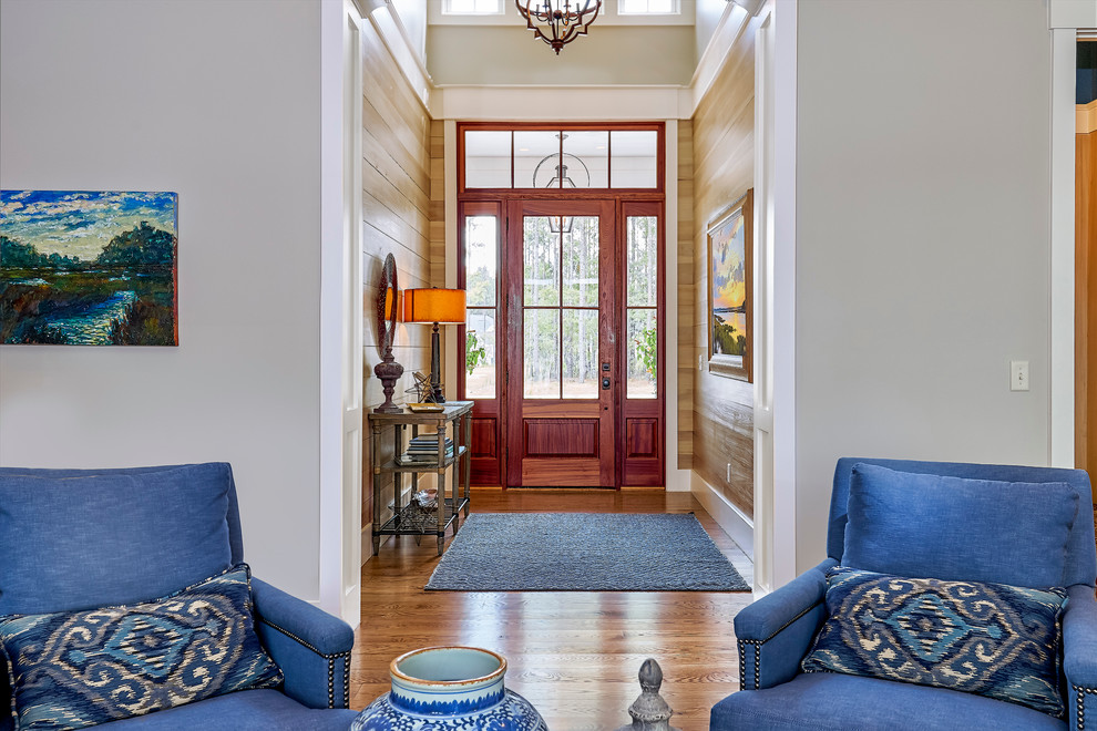 Inspiration for a large transitional foyer in Charleston with beige walls, medium hardwood floors, a single front door and a medium wood front door.