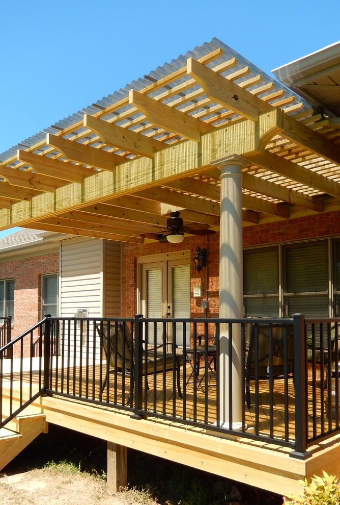 Photo of a traditional backyard verandah in Other with decking and a pergola.