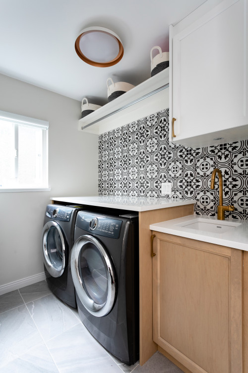 Light Wood Cabinets with Brass Accents and Tiles