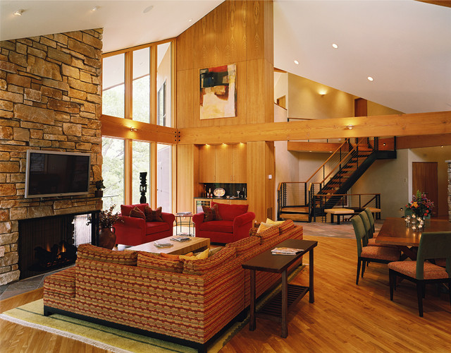 vaulted living room with fireplace
