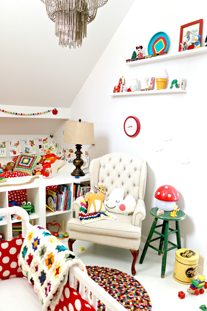 Photo of a mid-sized scandinavian gender-neutral kids' room in Las Vegas with white walls, painted wood floors and white floor.