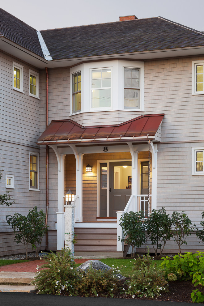 This is an example of a traditional entryway in Portland Maine with a glass front door.