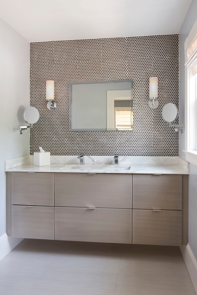 Photo of a contemporary master bathroom in Boston with a trough sink, flat-panel cabinets, grey cabinets, marble benchtops, a double shower, brown tile, ceramic tile, grey walls and porcelain floors.
