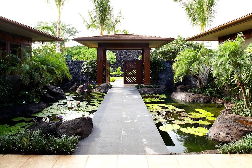 This is an example of a tropical garden in Hawaii with a water feature.