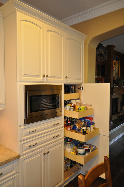 tall kitchen cabinet pantry with roll-out shelves on full-extension soft close undermount slides