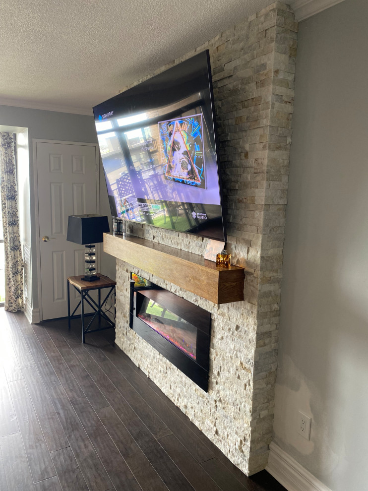 Stone Fireplace w/ Wooden Mantle & Mounted TV