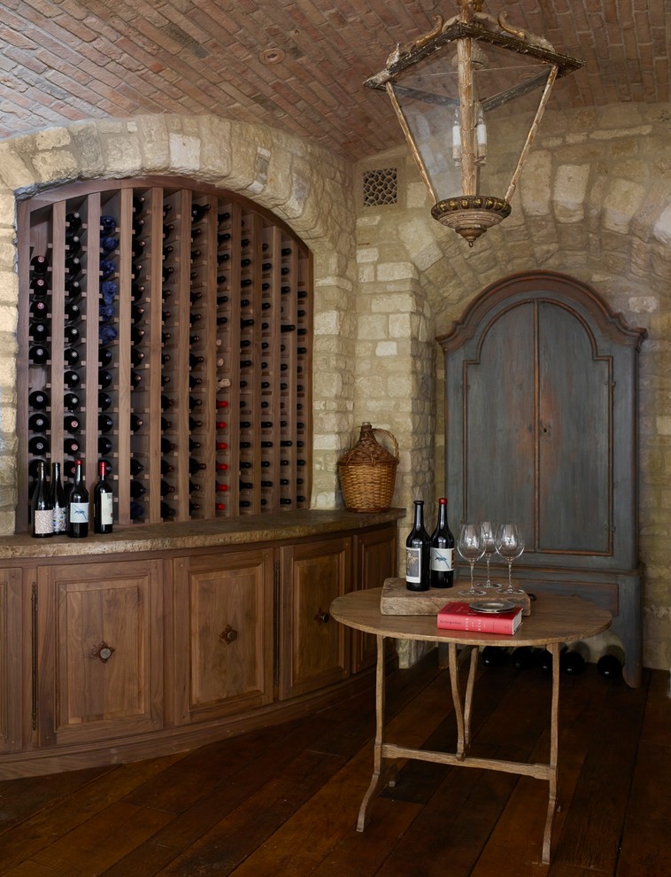 Inspiration for a mediterranean wine cellar in Orange County.