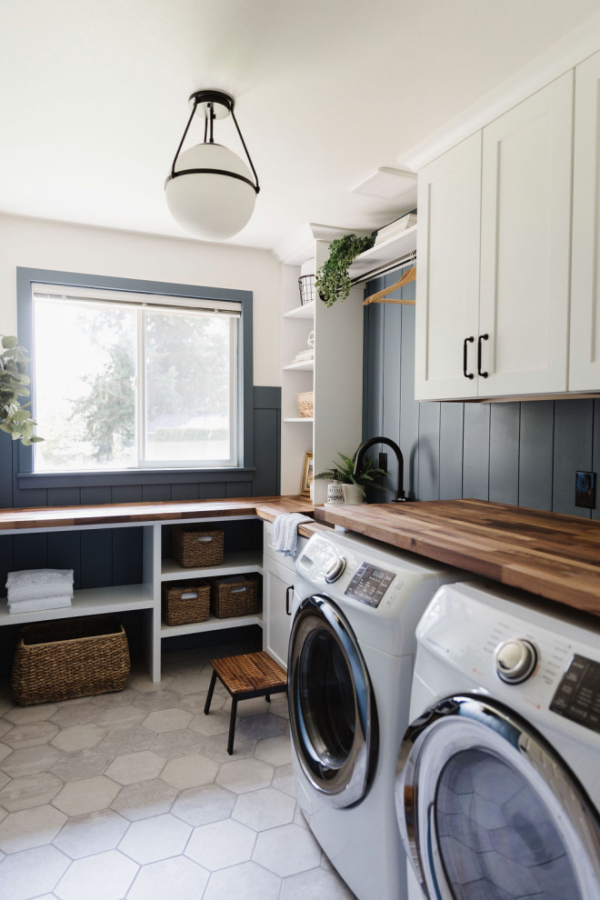 Transitional laundry room photo in Seattle