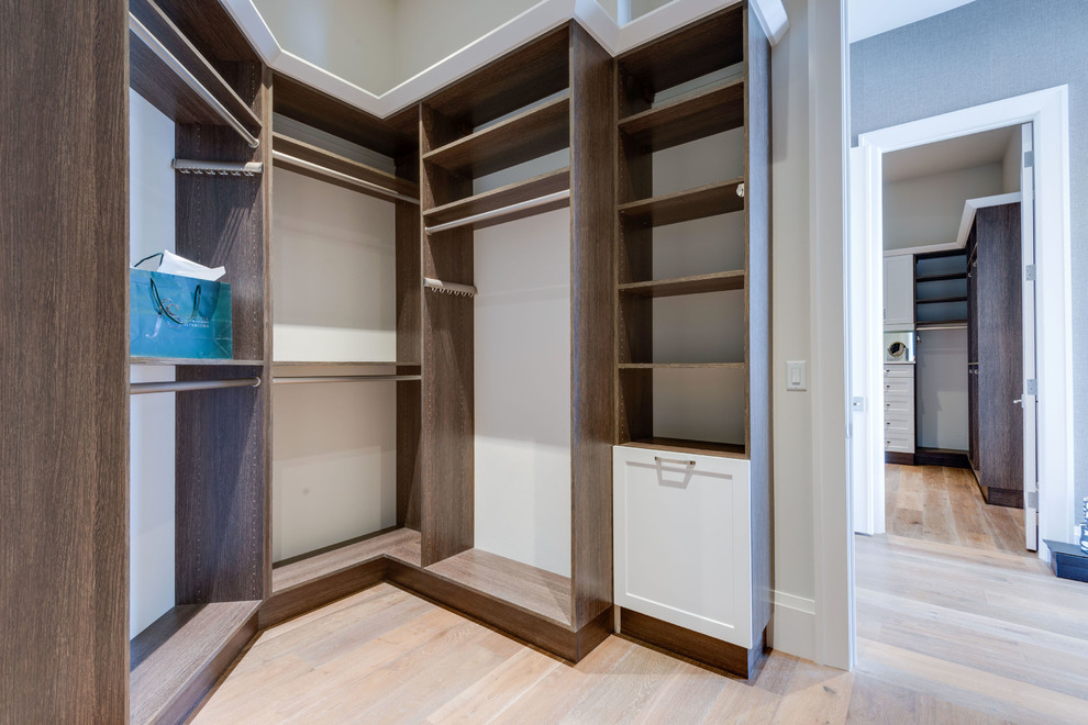 Inspiration for a large walk-in closet remodel with shaker cabinets