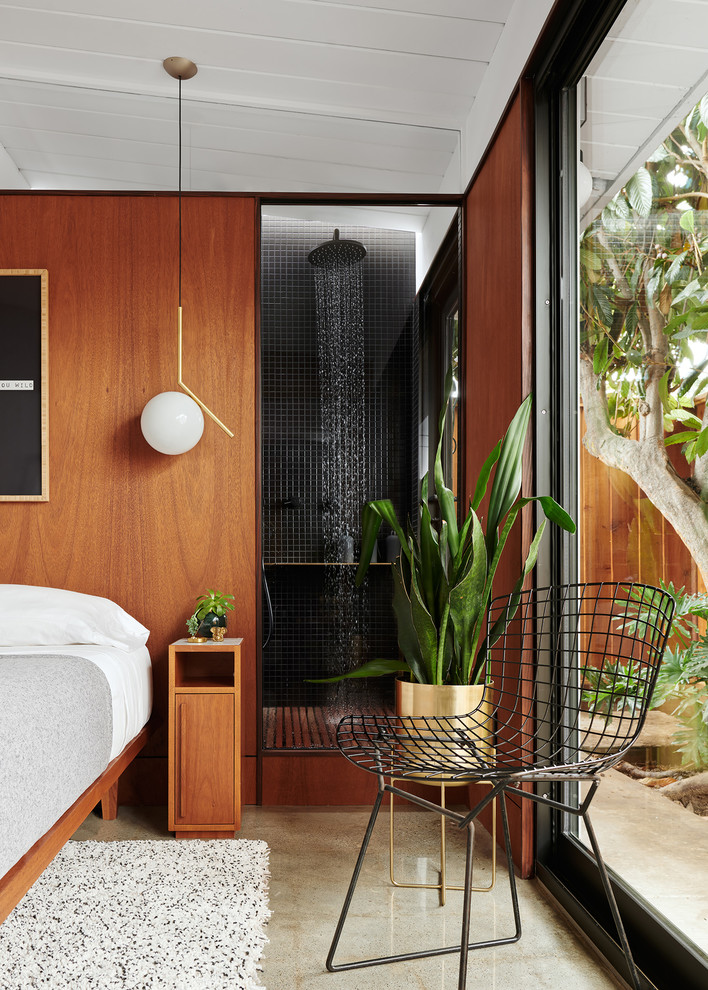 Photo of a small contemporary master bathroom in San Francisco with flat-panel cabinets, medium wood cabinets, a double shower, a wall-mount toilet, black tile, ceramic tile, black walls, concrete floors, a pedestal sink, grey floor and an open shower.