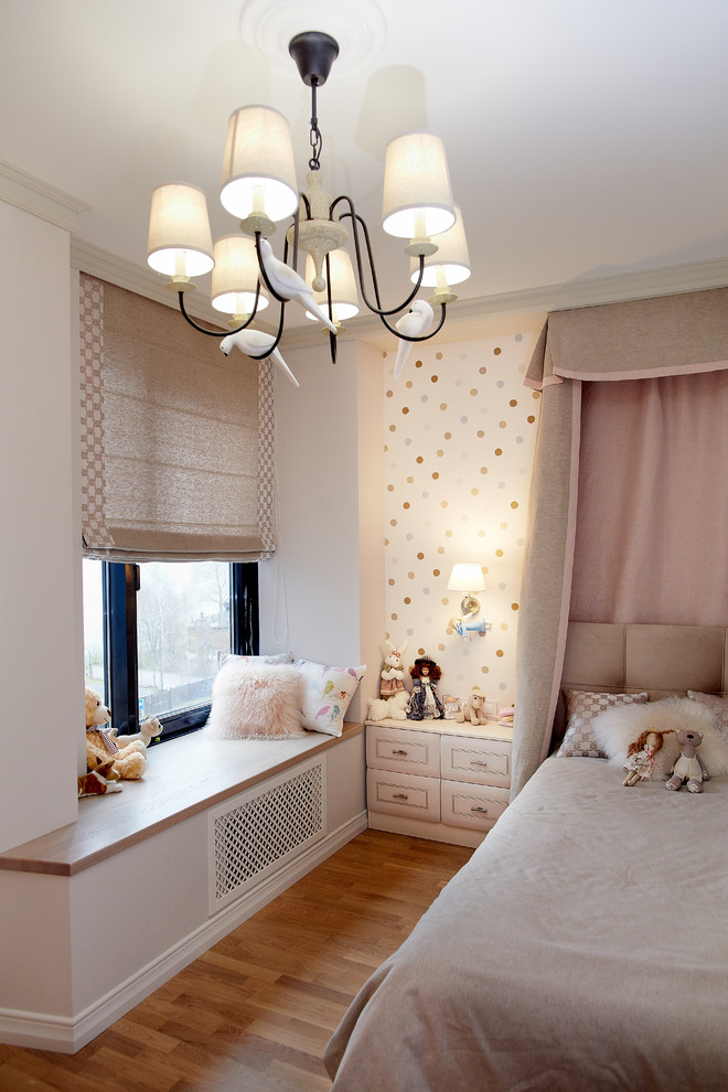 Transitional kids' bedroom in Other with medium hardwood floors and brown floor for girls.