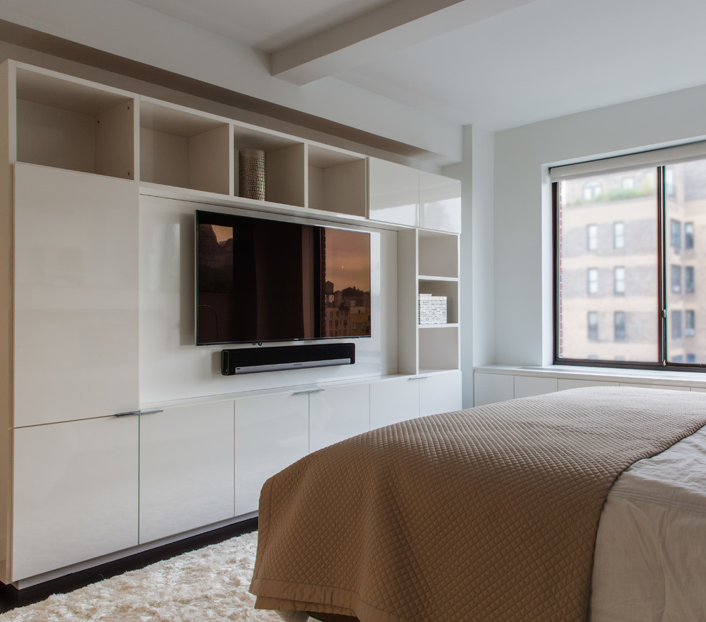 Inspiration for a large contemporary master bedroom in New York with white walls and dark hardwood floors.
