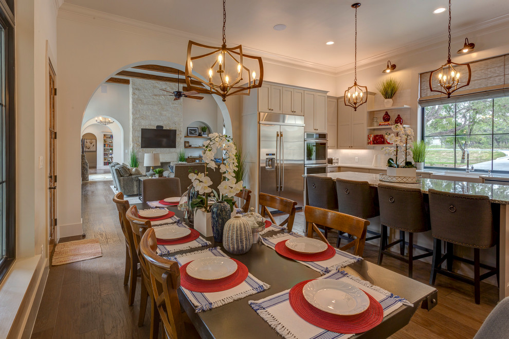 Inspiration for a mid-sized country open plan dining in Austin with white walls, medium hardwood floors, no fireplace and brown floor.