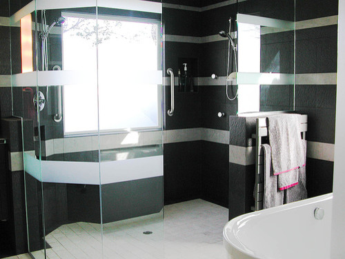 Design ideas for a large contemporary master bathroom in New York with black tile and stone tile.