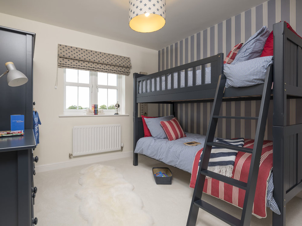 This is an example of a mid-sized transitional gender-neutral kids' bedroom for kids 4-10 years old in Other with beige walls, carpet and beige floor.