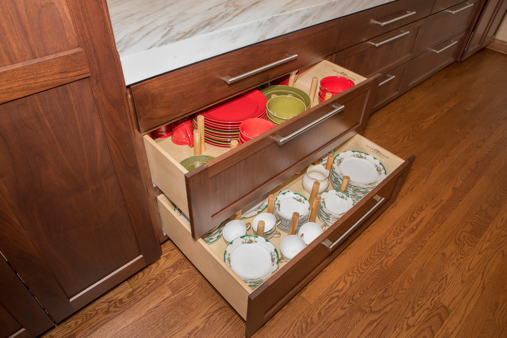 Enclosed kitchen - huge transitional l-shaped medium tone wood floor enclosed kitchen idea in Chicago with an undermount sink, flat-panel cabinets, medium tone wood cabinets, marble countertops, white backsplash, stone slab backsplash, stainless steel appliances and an island