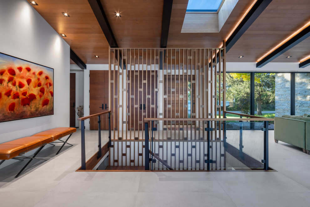 Pivot front door - mid-century modern porcelain tile, gray floor and vaulted ceiling pivot front door idea