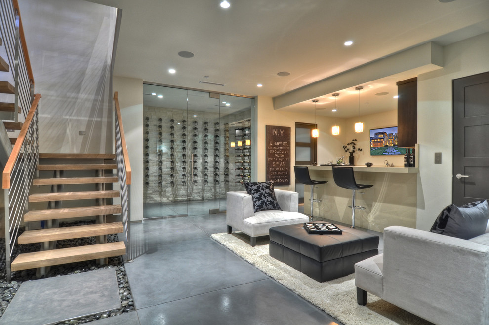 Inspiration for a contemporary basement in Orange County with grey floor.