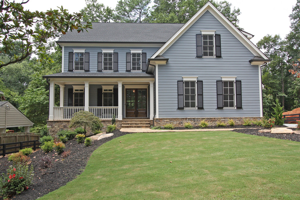 Photo of a traditional two-storey blue exterior in Atlanta.