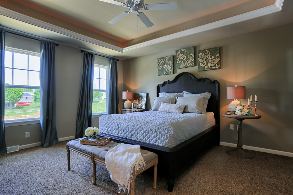 Design ideas for a large traditional master bedroom in Other with beige walls and carpet.