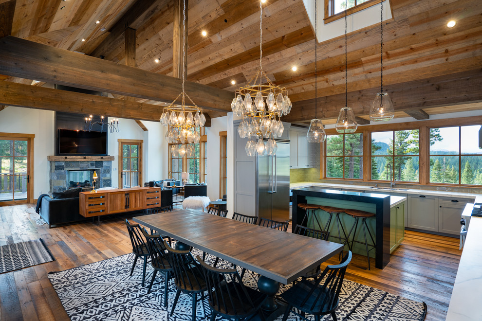 Mid-sized country open plan dining in Other with white walls, medium hardwood floors and brown floor.
