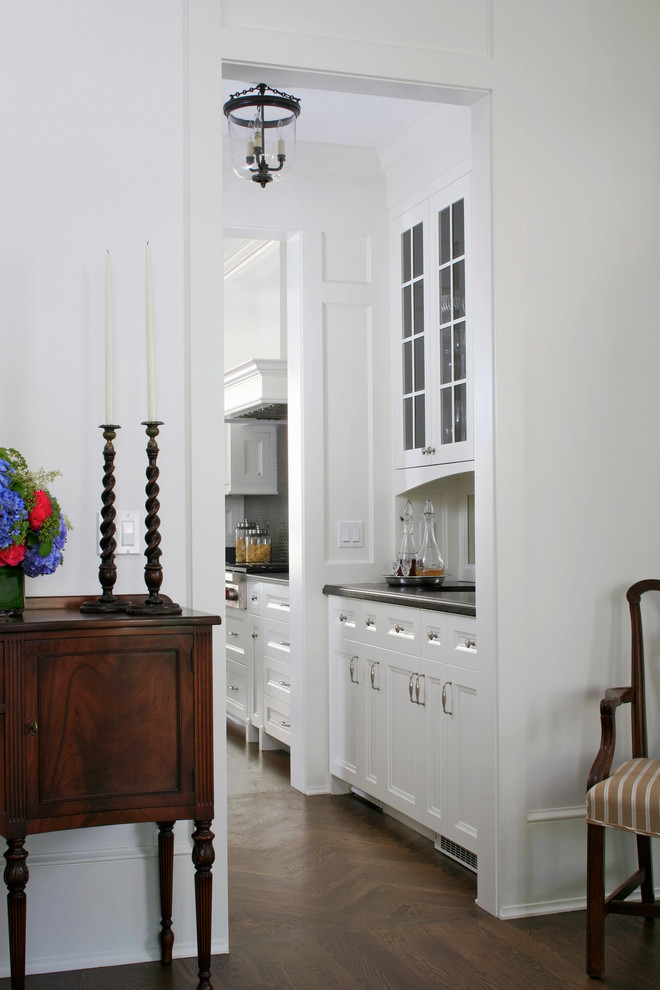 Inspiration for a large timeless home bar remodel in Chicago