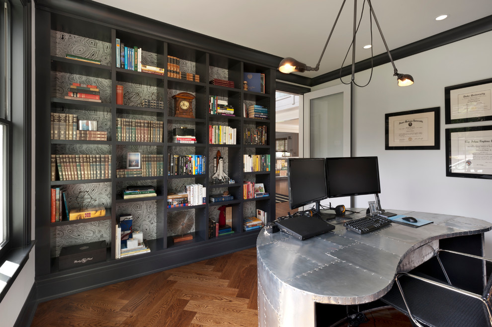 Mid-sized industrial study room in New York with white walls, medium hardwood floors, a freestanding desk and no fireplace.