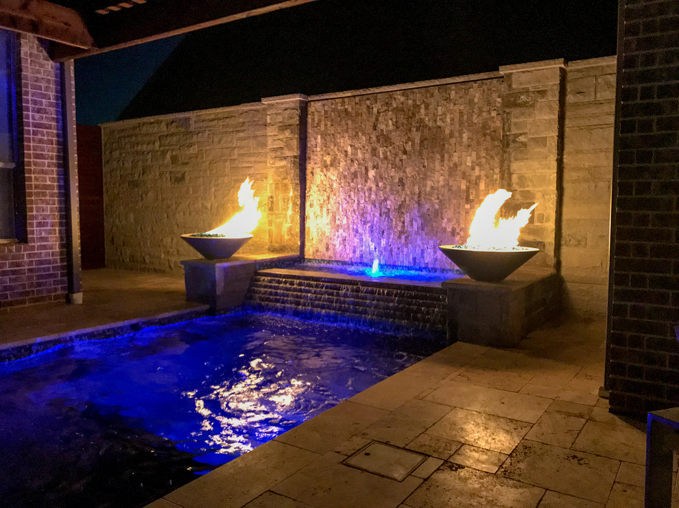 Inspiration for a small modern courtyard rectangular pool in Dallas with a hot tub and natural stone pavers.